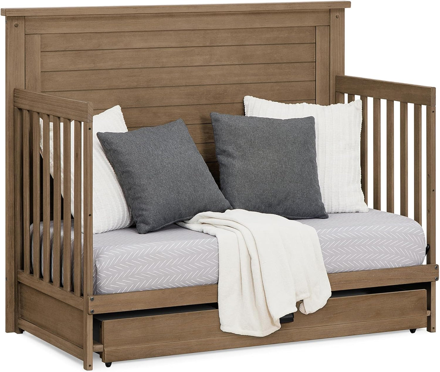 Delta Children Simmons Kids Caden 6-in-1 Convertible Crib with Trundle Drawer, Greenguard Gold Certified, Aged Oak